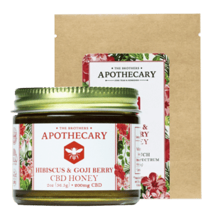 A Jar and a packet of Hibiscus CBD Honey by the Brother's Apothecary